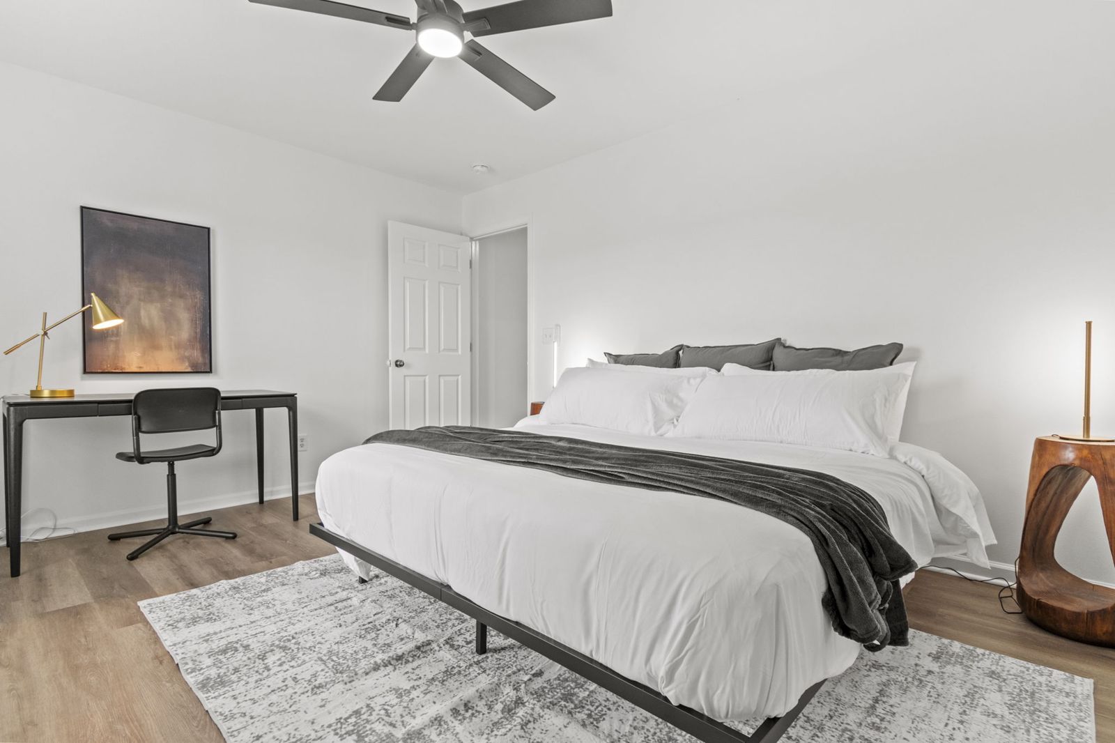 Second bedroom with king bed and workstation